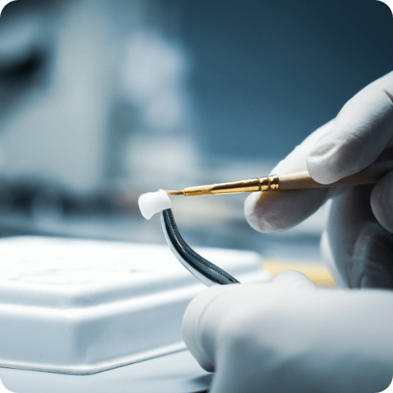 Dental technician crafting a dental restoration