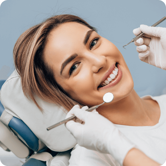 Woman smiling while visiting dental office in Eugene Oregon