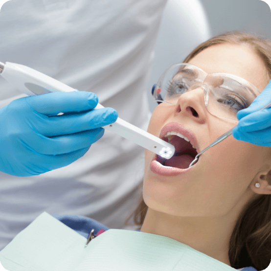 Dentist capturing smile images using intraoral camera dental technology in Eugene