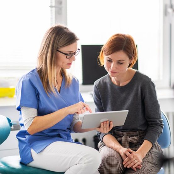 a patient talking with her dentist