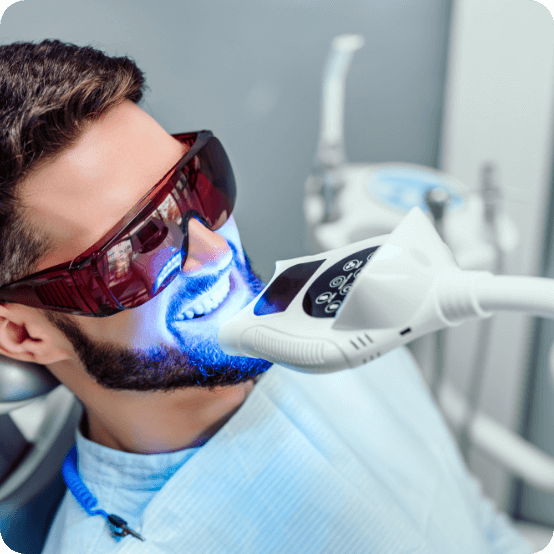 Man receiving professional teeth whitening