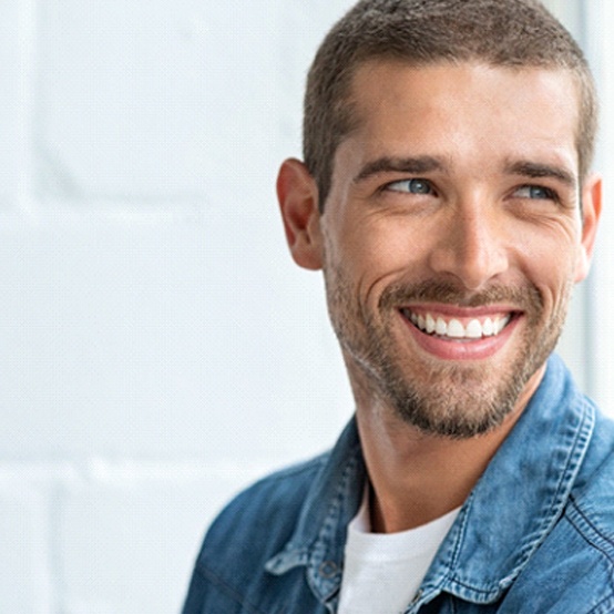 Man smiling after visiting cosmetic dentist in Eugene