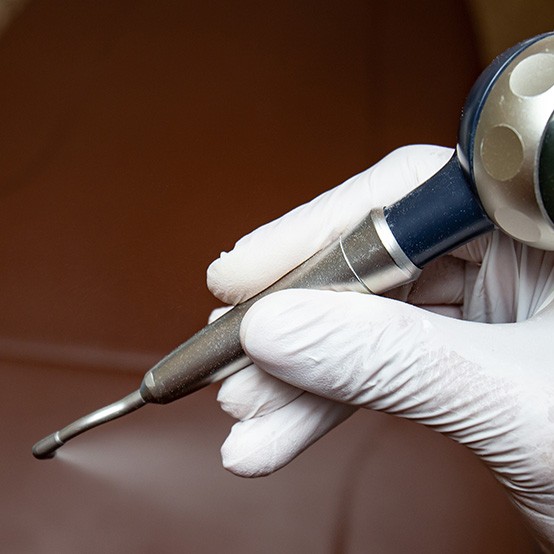 Close up of EMS Airflow Technology in Eugene held by a gloved hand