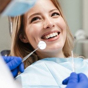 Lady smiles at dentist