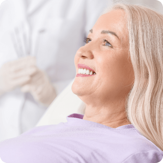 Senior woman smiling after getting dental implants