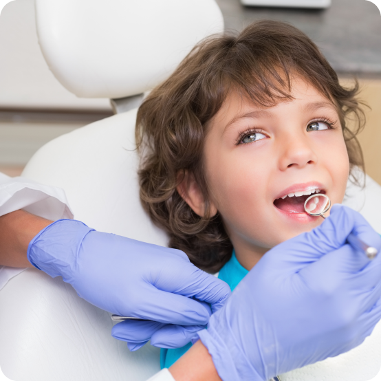 Dentist examining child's smile