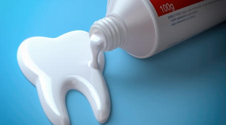 Toothpaste used to paint a tooth
