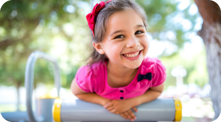 Little girl with healthy smile thanks to dental sealants