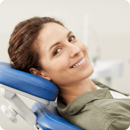 Woman smiling during preventive dentistry visit for teeth cleaning in Eugene