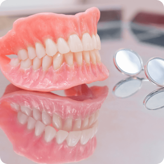 Set of full dentures on a tabletop