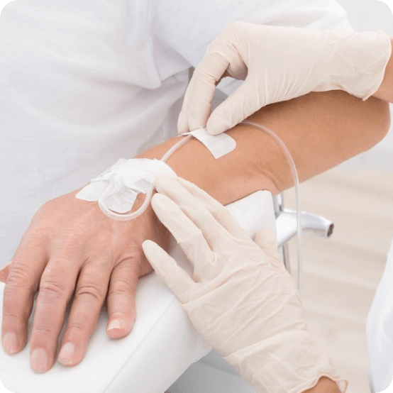 Dental team member placing an I V sedation dentistry drip