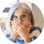 Older woman covering her mouth with her hands