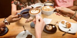 Group of friends enjoying coffee together 